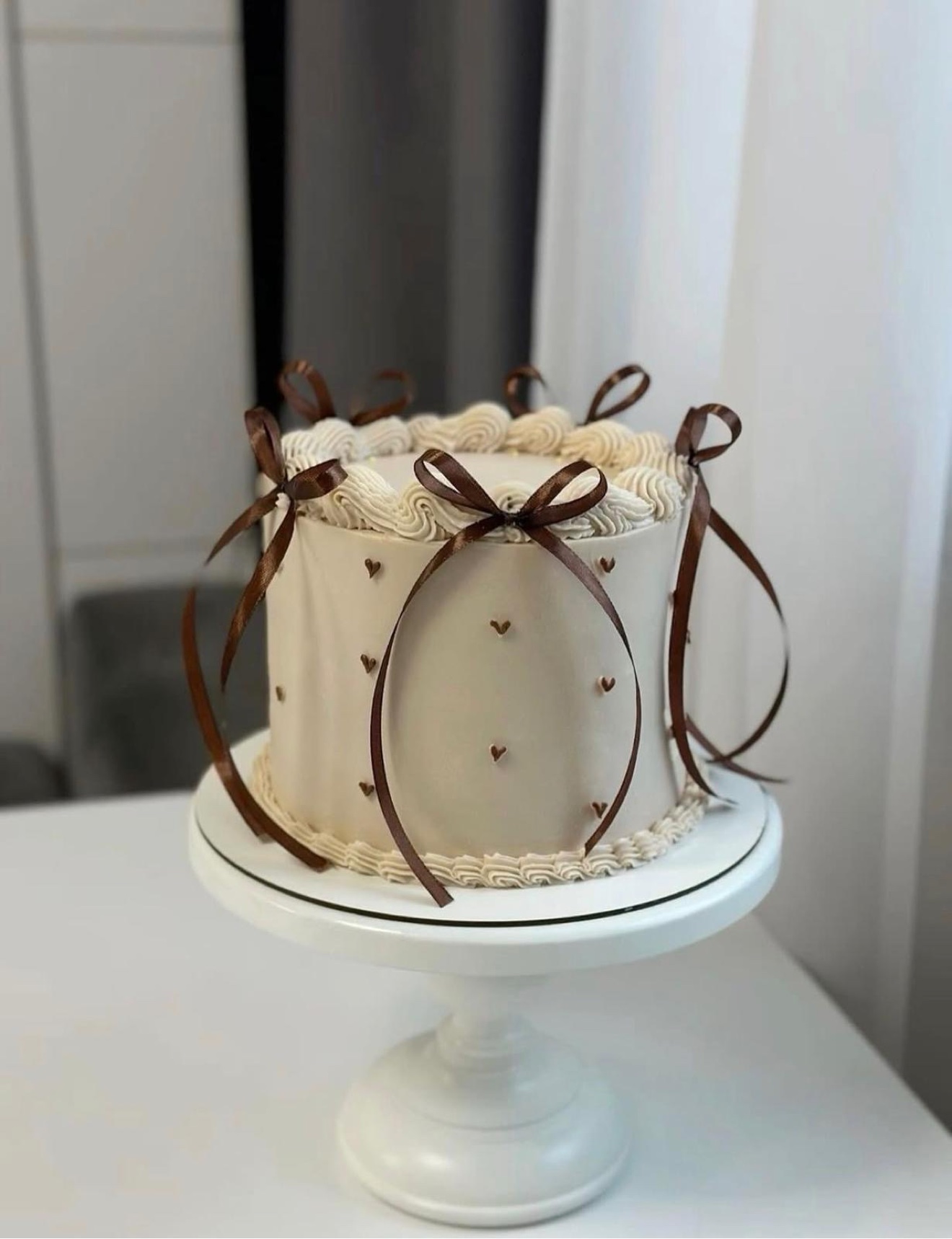 Beige ribbon bow cake